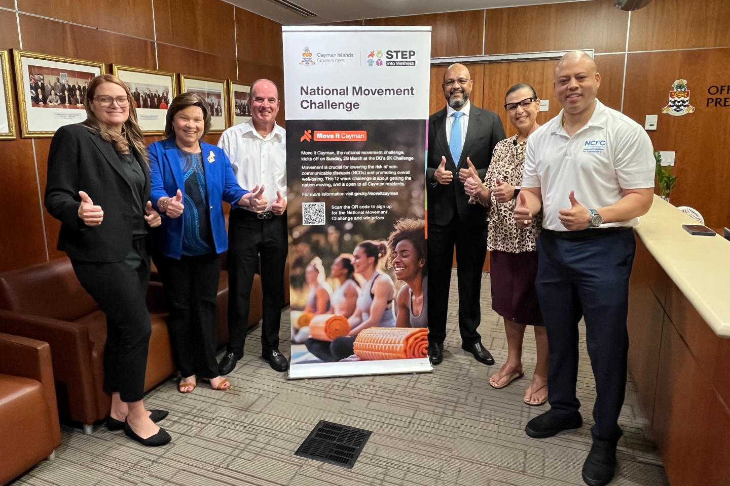 NCFC government Hon. Katherine Ebanks-Wilks, Ms. Heather Bodden, Hon. Gary Rutty, Hon. Isaac Rankine, Ms. Julie Hunter, and Hon. André Ebanks with thumbs up promoting the Move it Cayman challenge. .png